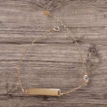 Damen-Armband in Gold mit Namensschild und weißem Stein.